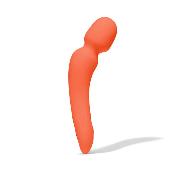 Dame Min Mini Wand in papaya orange at a diagonal angle, showcasing curved silhouette and matte finish