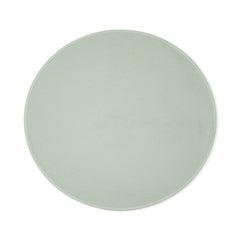 Dame throw blanket laid flat, showing smooth sage green circular silhouette from above