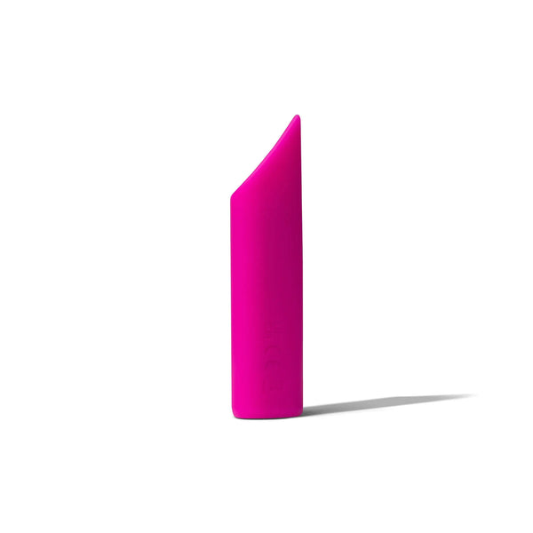 Dame Zig pink silicone bullet vibrator standing alone, displaying the diagonal tip profile