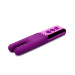 Dark Cherry Le Wand Deux lying flat, showing split silicone tips and metallic button panel