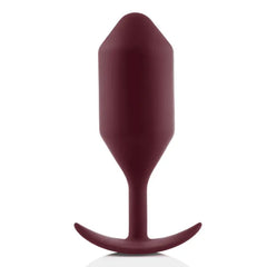 Dark red b-Vibe Snug Plug 5 silicone anal plug front view with curved anchor base