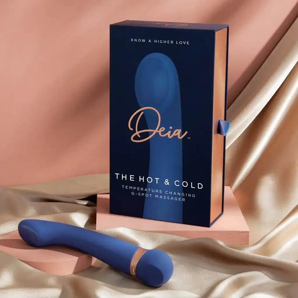 Deia Hot & Cold G-spot massager in navy blue beside its elegant dark gift box