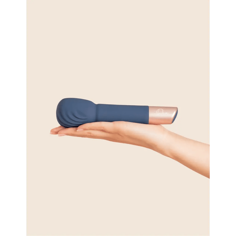 deia wand massager holding on the hand