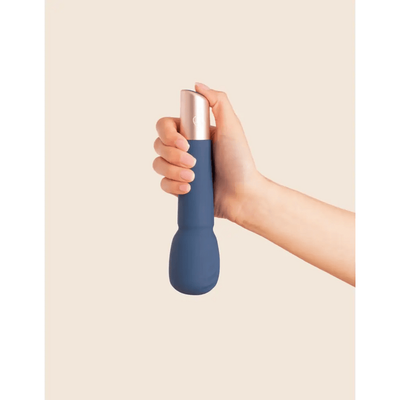 person holding a wand massager