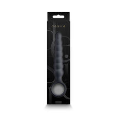 Desire Lucent wand displayed inside open retail box, showing smoke grey beaded shaft and loop handle