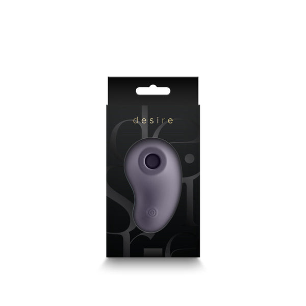 Desire Tresor clitoral stimulator displayed inside its black retail box, front view