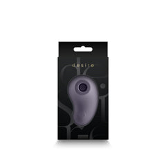 Desire Tresor clitoral stimulator displayed inside its black retail box, front view