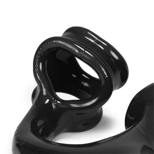 Detail view of Alien Tail's dual cock-and-ball ring base showing stretchy TPR construction