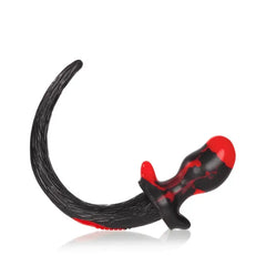 Detail view of Beagle puppy tail plug base and tapered body in bold black-dominant swirl
