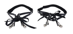 Detail view of black garter set showing silver clip hardware and layered ribbon bow styling