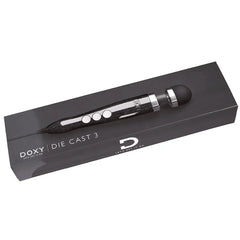 Die Cast 3 wand massager resting in its slim dark branded Doxy packaging box
