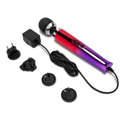 Die Cast wand massager with international plug adapter set laid out on white surface