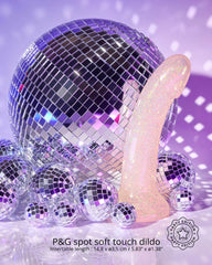 Dildolls Extravaganza pearlescent glitter dildo beside mirrored disco balls, party edition
