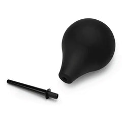 Disassembled enema bulb with removable nozzle detached, body-safe silicone construction