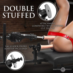 Close-up of double penetration sex machine attachment showing suction cup and Vac-U-Lock dildo adapter compatibility