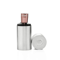 Doxy Bullet Vibrator lifted from its brushed steel travel canister with branded lid placed beside it