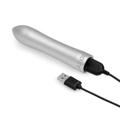 Doxy Bullet Vibrator silver connected to magnetic USB charging cable, side angle