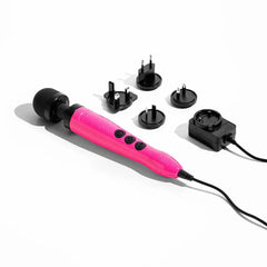 Doxy Die Cast 3 wand with international plug adapter set and power supply laid out on white surface