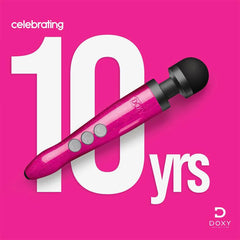 Doxy Die Cast 3R wand massager displayed against pink background celebrating 10 years