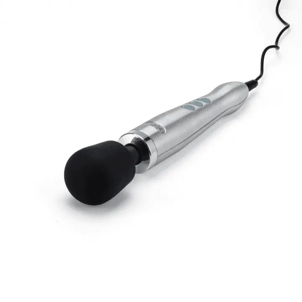 Doxy Die Cast Wand lying at an angle showing corded power cable and rounded black silicone head