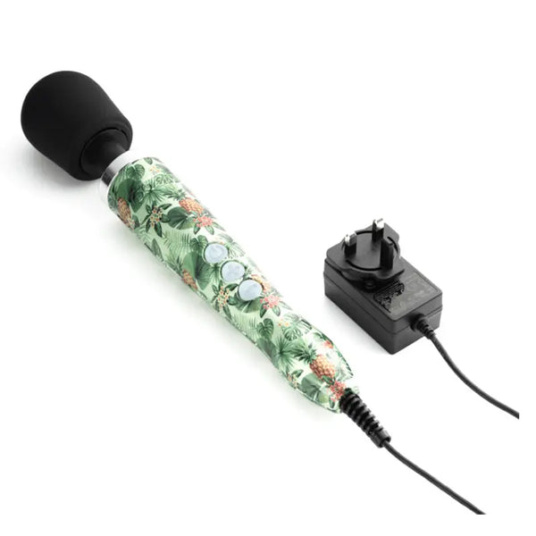 Doxy Die Cast Wand Vibrator laid flat beside its UK plug-in power adapter and cord