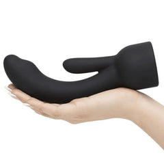 Doxy Nexus Rabbit Attachment resting in open palm, showing curved dual-tip silicone design
