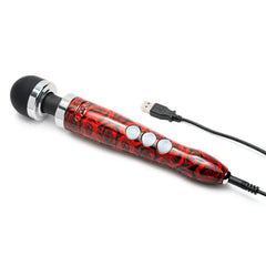 Doxy wand massager with red rose body, three control buttons, and USB charging cable attached