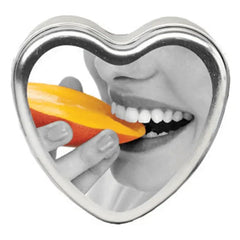 Earthly Body Edible Massage Candle Mango in a heart-shaped silver tin with window lid