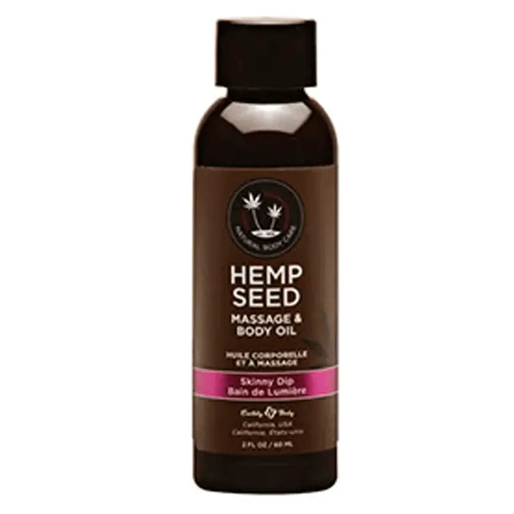 Earthly Body Hemp Seed Massage & Body Oil in Skinny Dip, 2 fl oz dark bottle with pink label