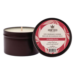 Earthly Body massage candle open beside lid revealing white wax and cotton wick inside