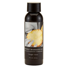 Earthly Body Pineapple Edible Massage Oil in a 2 fl oz bottle with black cap