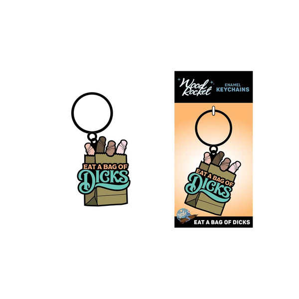 Eat A Bag Of Dicks keychain shown beside its orange Wood Rocket branded retail card packaging