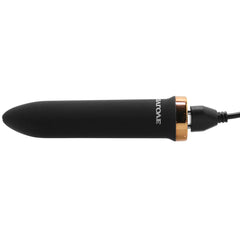 Evolved Four Play bullet vibrator charging via magnetic cable, gold accent base
