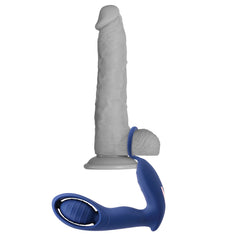 Extra Mile cock ring and stimulator attachment demonstrated on a realistic dildo for scale reference