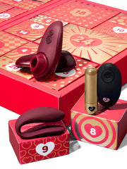 Couples calendar extras: Womanizer lube, massage oil and sex position card game