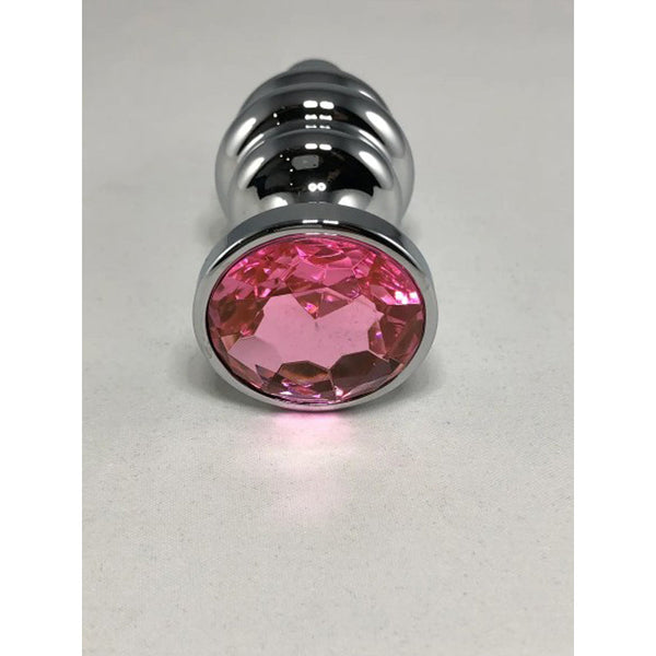 Close-up of the faceted pink crystal base on the silver Thread Anal Plug Large, showing gem detail