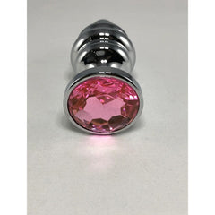 Close-up of the faceted pink crystal base on the silver Thread Anal Plug Large, showing gem detail