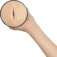 Close-up of Feel Generic pale CPB-V2 soft skin-like sleeve opening held in one hand for scale