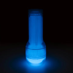 Feel Glow stroker glowing vivid blue in complete darkness, demonstrating phosphorescent material feature