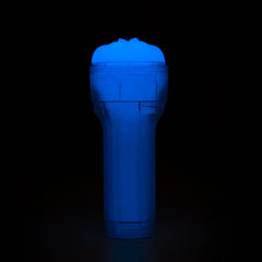Feel Glow stroker standing upright fully glowing blue in dark environment, full-body phosphorescent effect visible