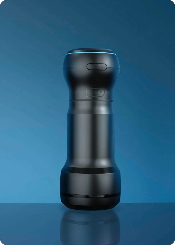 Feel by Kiiroo PowerBlow standing upright on blue surface, full device profile, dual-tone finish