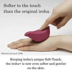 Finger pressing gently on soft-touch silicone surface of an Iroha+ vibrator