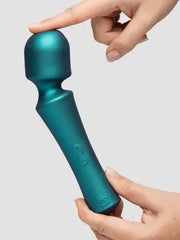 Finger pressing rounded head of teal ROMP Presto Wand to show flexible silicone tip
