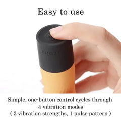 Finger pressing the single control button on the Iroha Zen's black base to cycle vibration modes