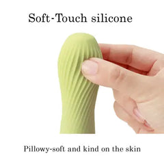 Close-up of finger pressing into zen MATCHA ribbed silicone tip demonstrating pillowy-soft material flexibility