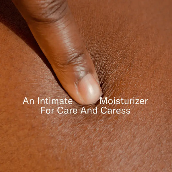 Fingertip gently pressing skin, showing Dame Play Balm as an intimate daily moisturizer