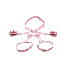 Flat lay of complete STRICT pink bondage harness set: waist belt, thigh bands, and wrist cuffs