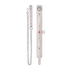 Flat lay of white collar and leash showing red stitching detail, silver hardware, and chain