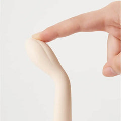 Flexible silicone tip of the Koharu vibrator bending gently under fingertip pressure