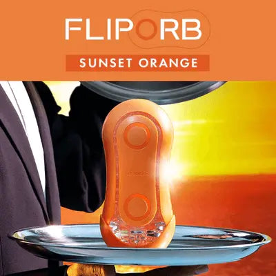 Flip Orb Sunset Orange presented on a silver tray with warm sunset backdrop and product name displayed